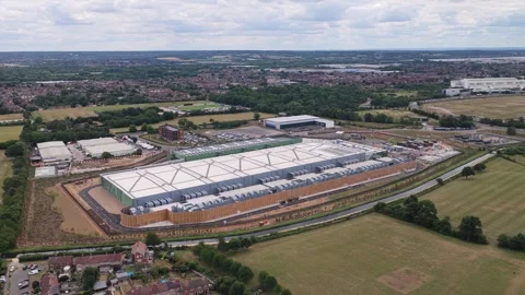 Aerial View of a Large Industrial Data Center Complex Surrounded by Rural Stock Footage 342077600