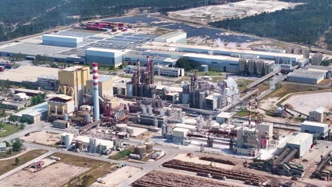 Aerial view of a large industrial pulp and paper mill plant Stock Footage 339674314