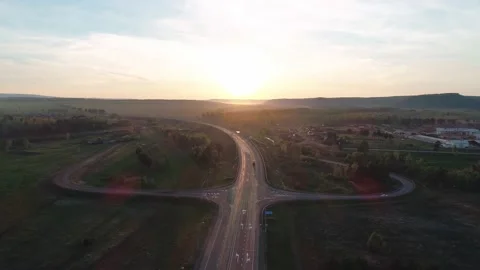 Aerial view of a large junction interchange with traffict in rural area in the Stock-Footage 196229765