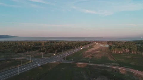 Aerial view of a large junction interchange with traffict in rural area in the Stock-Footage 196230477