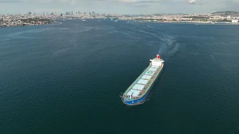 Aerial view of a large, loaded container cargo ship traveling over open ocean Stock Photos