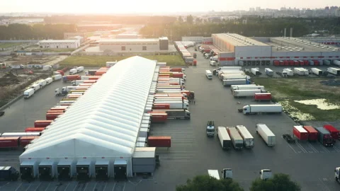 Aerial View: Large Logistics Distribution Hub with Semi Trucks at Loading Docks Stock Footage 326824472