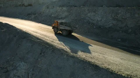  Aerial view of large mining trucks on a gold mine. Open pit mine quarrying Stock Footage 164387860