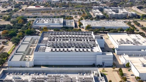 Aerial view of large modern AI or IT data centers in Richardson, Texas. New.. Stock Footage 323427465