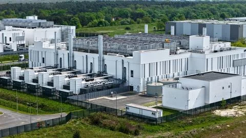 Aerial View of Large Modern Data Center Surrounded by Forest 写真素材