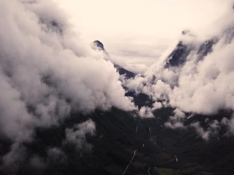 Aerial View of Large Mountain Covered in Fog, Trees, Forest in Norway Stock Footage 82981085