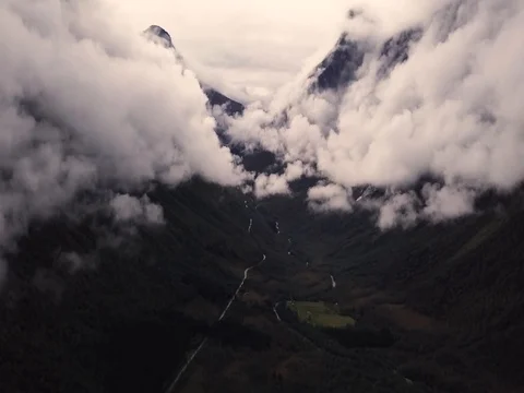 Aerial View of Large Mountain Covered in Fog, Trees, Forest in Norway Stock Footage 82981105