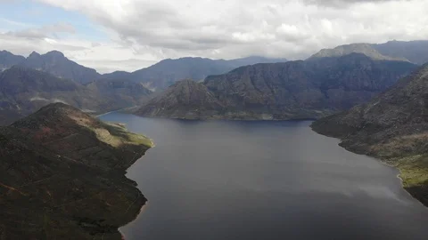 Aerial view of a large mountain dam Stock Footage 100931052