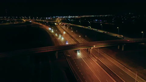 Aerial view of a large multi-lane highway with bridges and viaducts at night Stock Footage 201165398