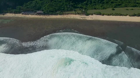 Aerial View Of Large Ocean Waves Breaking Near Nyang Nyang Beach Stock Footage 340578080