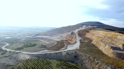 Aerial view of a large open pit cement mine, showing exposed layers Stock Footage 296195706