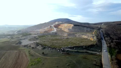 Aerial view of a large open pit cement mine, showing exposed layers Stock Footage 296196476