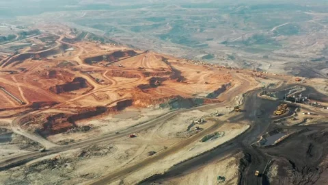 Aerial view of a large open pit coal mine excavation site Stock Footage 312391200