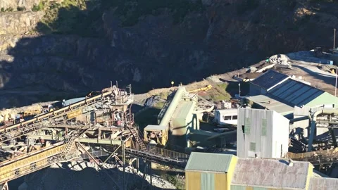 Aerial view of a large open-pit mining quarry and processing plant Stock Footage 340131390