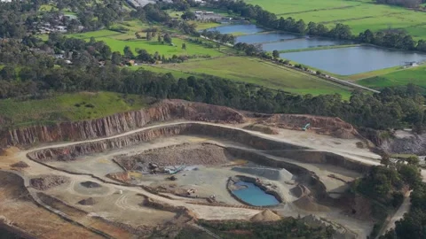 Aerial view of a large open pit stone quarry operating near rural area Видео 343617212
