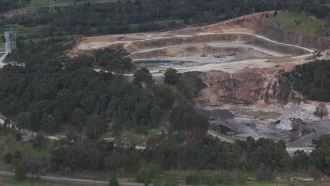 Aerial view of a large open-pit mining quarry Видео 343620379