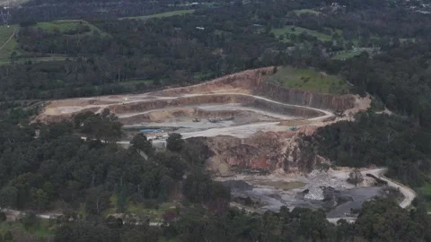 Aerial view of a large open-pit quarry mining operation Stock Footage 343621063