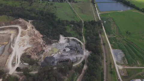 Aerial view of a large open pit mine in the countryside Stock Footage 343623557