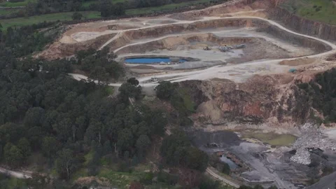 Aerial view of a large open-pit mining quarry Видео 343644023