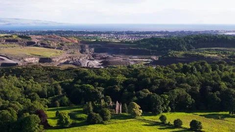 Aerial View Of Large Open Quarry And Surrounding Woodland 库存影片 337310392