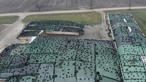 Aerial view of large pile of silage covered with plastic film and used tires Stock-Footage 204800142