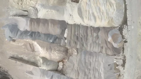 Aerial view of large piles of various colored sand and gravel materials 库存影片 334187827