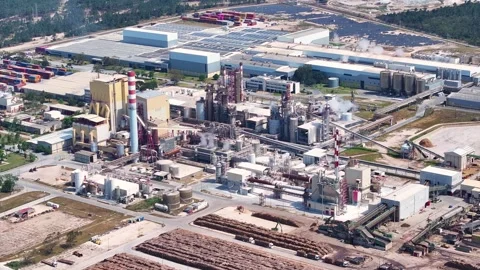 Aerial view of a large pulp and paper mill industry complex Stock Footage 340312406