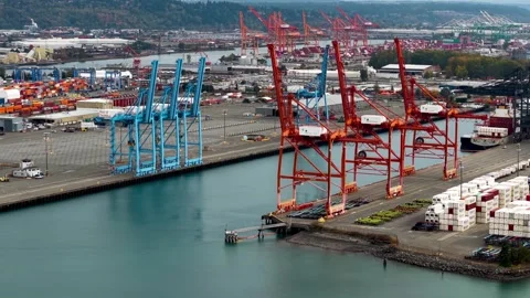 Aerial view of large red cranes at Port of Tacoma , is a major industrial c.. Video stock 322942279