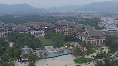 Aerial View of Large Resort Complex and Pool Surrounded by Lush Greenery in Sany Stock Footage 341709397