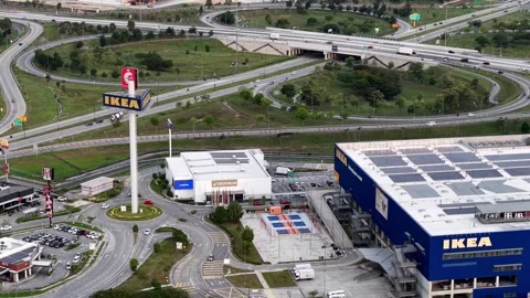 Aerial view of large retail store near highway interchange with parking lot Stock-Footage 337669142