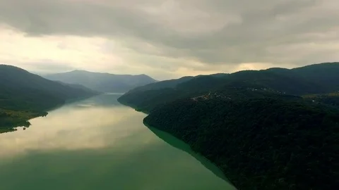 Aerial view of a large river and high mountains. Georgia. Stock Footage 82244318