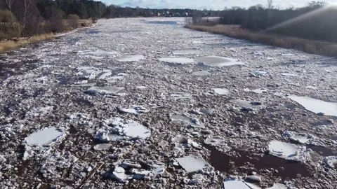 Aerial view of a large river of a huge blocks of pack ice going down to the sea Stock Footage 149819180
