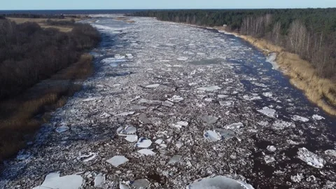 Aerial view of a large river of a huge blocks of pack ice going down to the sea Stock Footage 149819185