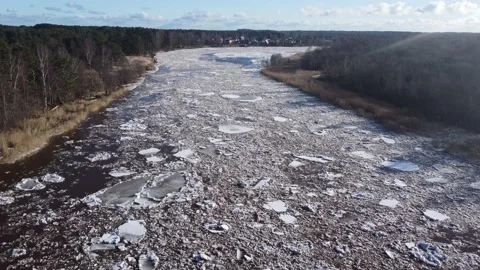 Aerial view of a large river of a huge blocks of pack ice going down to the sea Stock Footage 149819201