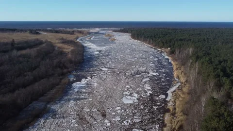Aerial view of a large river of a huge blocks of pack ice going down to the sea Stock Footage 149819213