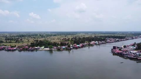 Aerial view of the large river in Margasari, South Kalimantan, housing on t.. Stock Footage 292510044