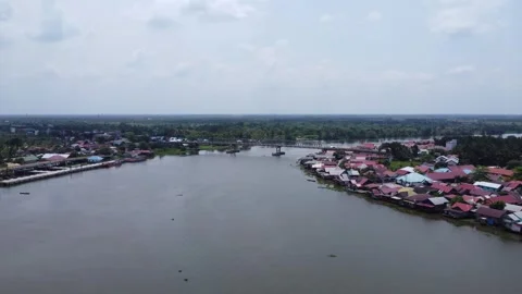 Aerial view of the large river in Margasari, South Kalimantan, housing on t.. Stock Footage 292512908