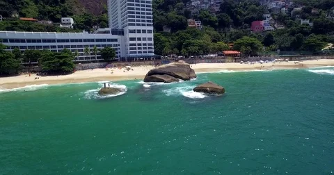 Aerial view of a large rock on the beach. Rio De Janeiro, Brazil. Shot in 4K. Stock Footage 77748824