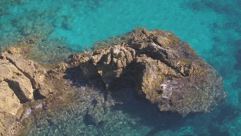 Aerial view of large rock pool on turquoise waters Stock Footage 101564544