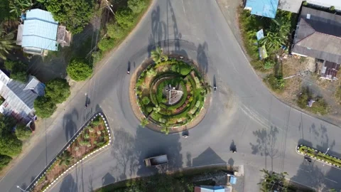Aerial view of a large roundabout at an intersection forming a busy looking.. Stock Footage 247936634