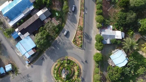 Aerial view of a large roundabout at an intersection forming a busy looking.. Stock Footage 247936655