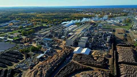 Aerial View of Large Sawmill Complex with Smokestacks and Processing Stock Footage 289230189