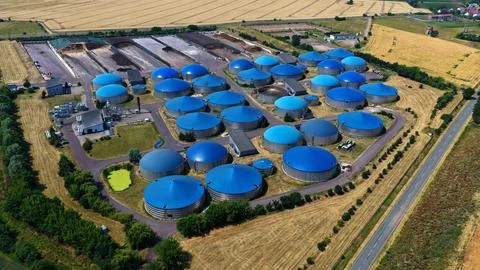 Aerial View of Large-Scale Blue Dome Biogas Plant in Farmland Stock Photos