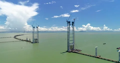 Aerial View of Large Scale Bridge Construction Project Over Open Sea Waters 動画素材 342091036