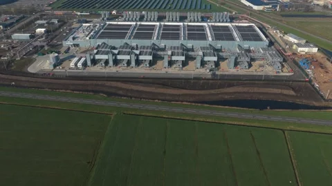 Aerial view of a large scale cloud data center construction Stock Footage 334056874