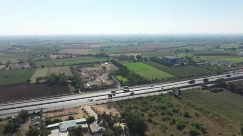 Aerial View of Large Scale Construction Development Project Near Highway Road Stock Footage 337912289