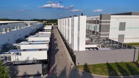 Aerial view of a large scale data center building and server cooling Stock Footage 346147331
