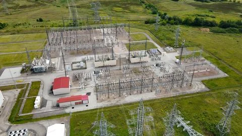 Aerial view large scale electrical substation powering AI data center Stock Photos