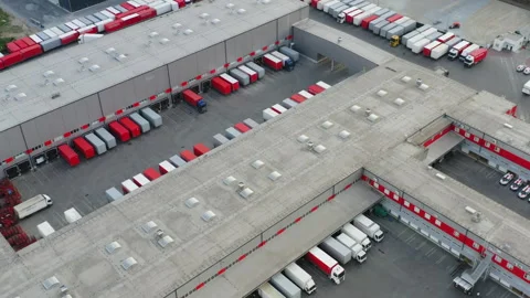 Aerial View Large-Scale Logistics Distribution Center with Multiple Loading Dock Stock Footage 327678756