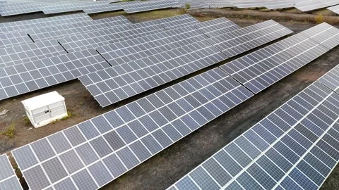 Aerial View of Large-Scale Solar Panel Farm Video stock 327984153